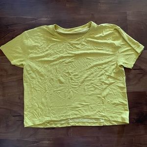 Lululemon cropped yellow tee.
